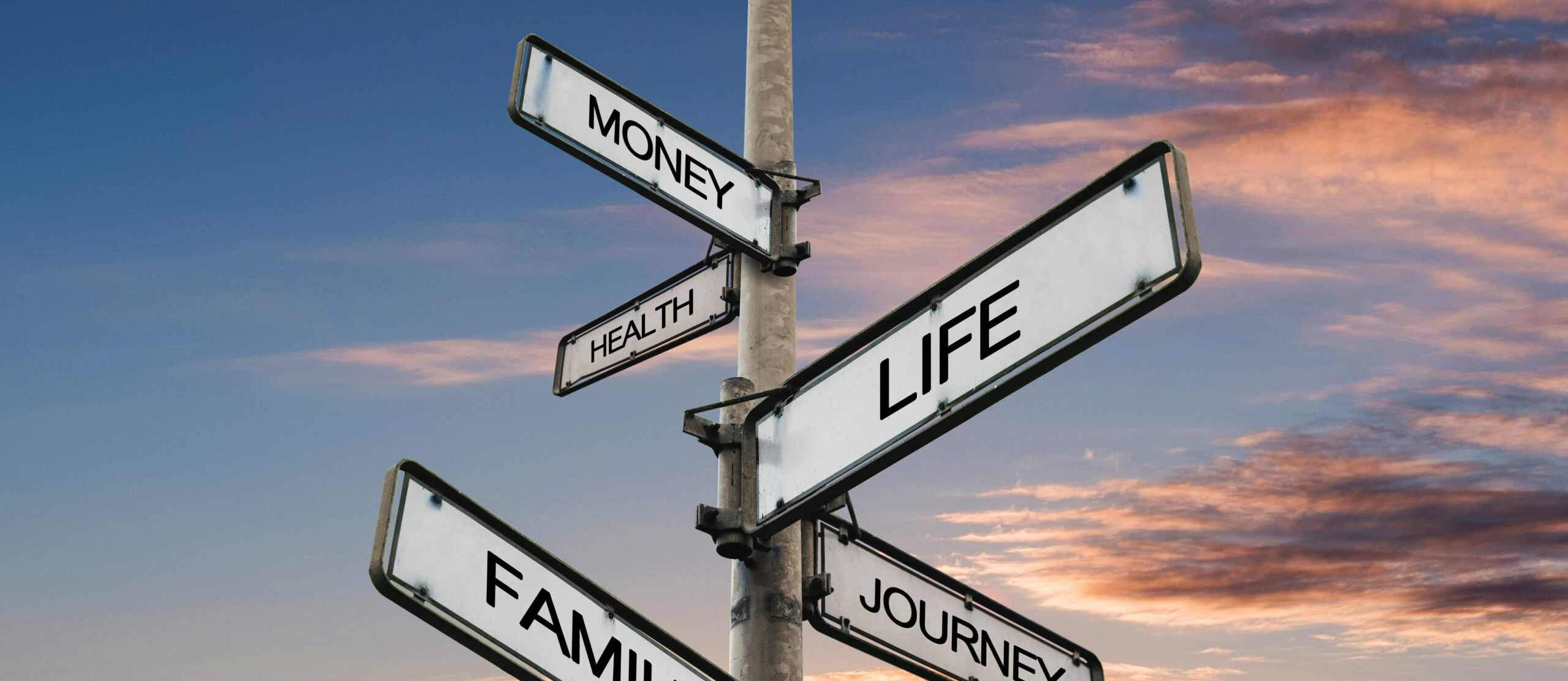 Life balance choices signpost, with sunrise sky backgrounds